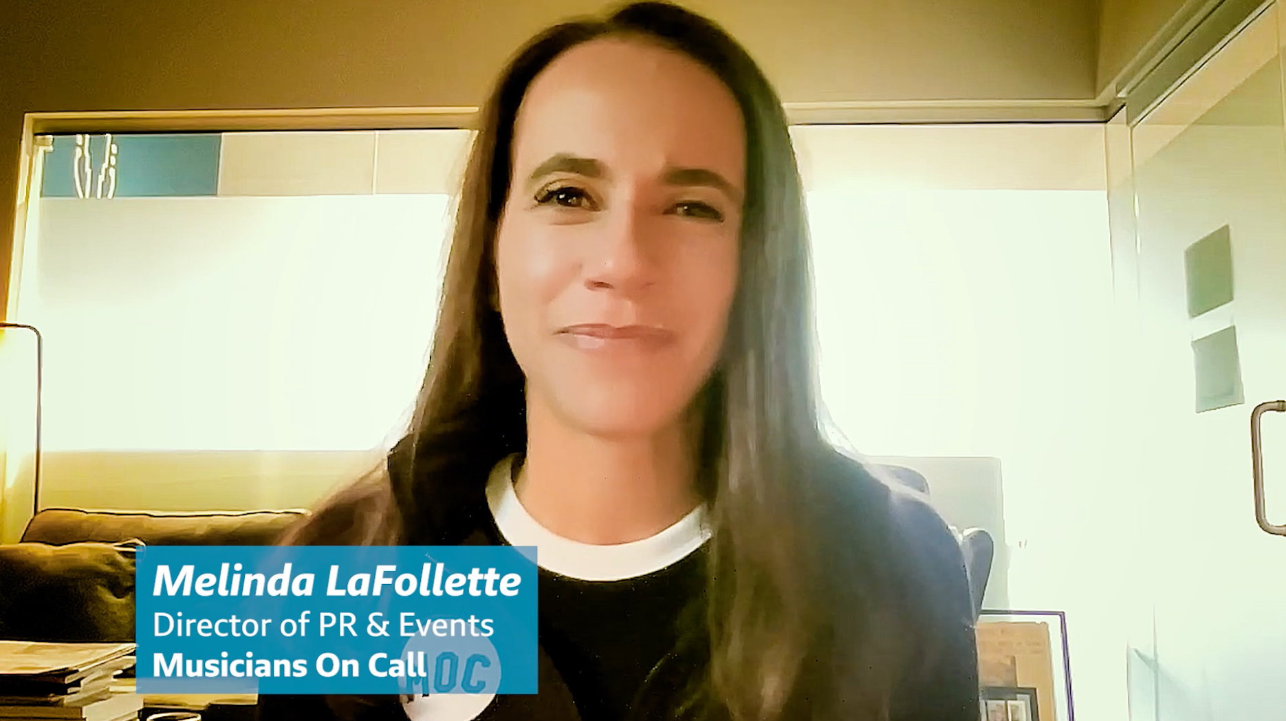 Melinda LaFollette, Director of PR & Events for Musicians On Call, a woman with long dark hair, smiling at the camera.
