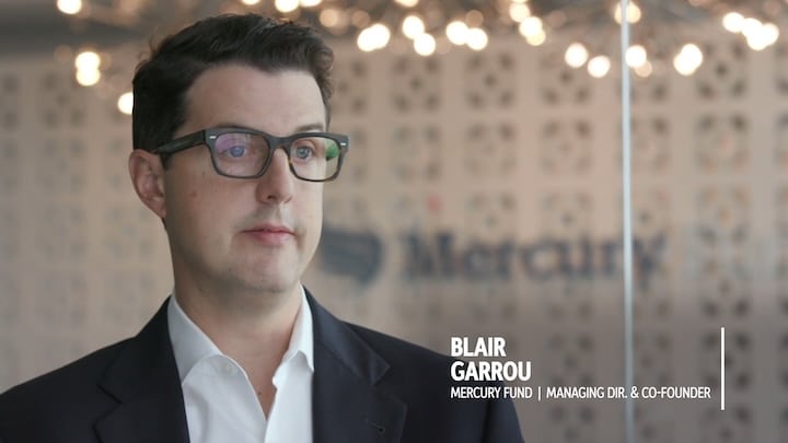 Blair Garrou, a man in glasses and a suit, with his name and title 'Mercury Fund | Managing Dir. & Co-Founder' displayed.